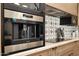 Modern Wolf brand stainless steel coffee maker on the counter at 2421 E Montebello Ave, Phoenix, AZ 85016