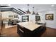 Spacious kitchen with center island, stainless steel appliances, and a view to the backyard at 2421 E Montebello Ave, Phoenix, AZ 85016