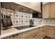 Close up of countertops and stovetop, knife block, stainless steel vent hood at 2421 E Montebello Ave, Phoenix, AZ 85016