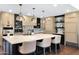 Beautiful kitchen featuring a large island with seating, tile backsplash, and modern stainless appliances at 2421 E Montebello Ave, Phoenix, AZ 85016