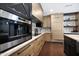 Close-up of the kitchen with built-in appliances and cabinetry at 2421 E Montebello Ave, Phoenix, AZ 85016