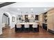 Spacious kitchen with a large island, pendant lighting, tile backsplash, and stainless steel appliances at 2421 E Montebello Ave, Phoenix, AZ 85016
