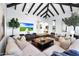 Open-concept living room features a comfortable seating area and a media center, perfect for relaxation and entertainment at 2421 E Montebello Ave, Phoenix, AZ 85016