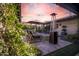 Backyard patio featuring a cozy fire pit, lounge chairs and potted plants, perfect for relaxation at 2421 E Montebello Ave, Phoenix, AZ 85016