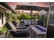 Luxury backyard with a sparkling pool, a waterfall feature and an outdoor lounge area at 2421 E Montebello Ave, Phoenix, AZ 85016