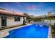 Inviting pool with travertine decking, water feature and outdoor BBQ perfect for enjoying evenings and entertaining at 2421 E Montebello Ave, Phoenix, AZ 85016