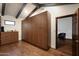 Walk-in closet with wall-to-wall cabinets, drawers, and hardwood flooring at 2421 E Montebello Ave, Phoenix, AZ 85016