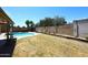 Expansive backyard with a pool, landscaping, and plenty of space for outdoor activities at 2424 E Aster Dr, Phoenix, AZ 85032