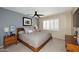 Cozy bedroom with a ceiling fan, and white shutters for plenty of natural light at 2424 E Aster Dr, Phoenix, AZ 85032
