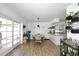 Dining area that features wood floors, modern light fixture, and lots of plants at 2424 E Aster Dr, Phoenix, AZ 85032