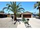 Charming single-story home featuring a well-maintained yard, desert landscaping, and a two-car garage at 2424 E Aster Dr, Phoenix, AZ 85032