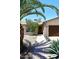 Charming single-story home featuring desert landscaping and a two-car garage at 2424 E Aster Dr, Phoenix, AZ 85032