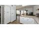 Bright kitchen features white cabinets, modern appliances, and an eat-in area with view to backyard at 2424 E Aster Dr, Phoenix, AZ 85032
