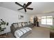 Inviting living room with a large comfortable sofa, carpet, and ceiling fan at 2424 E Aster Dr, Phoenix, AZ 85032