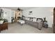 Inviting living room with a large comfortable sofa, carpet, and ceiling fan at 2424 E Aster Dr, Phoenix, AZ 85032
