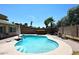 Spacious backyard pool with ample seating, surrounded by mature landscaping at 2424 E Aster Dr, Phoenix, AZ 85032