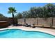 Serene pool view with mature trees, creating a private backyard oasis at 2424 E Aster Dr, Phoenix, AZ 85032