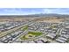 Aerial view of community and playground featuring many homes, green space, and desert landscape with mountain views in the distance at 24540 N 144Th Ave, Surprise, AZ 85387
