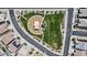 Aerial view of neighborhood park with playground, green space, and sidewalks surrounded by homes and streets at 24540 N 144Th Ave, Surprise, AZ 85387