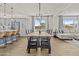 Dining room with wood table, island seating and living room combo at 24540 N 144Th Ave, Surprise, AZ 85387