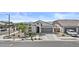Beautiful home with stucco walls, tile roof, neutral colors and desert landscaping at 24540 N 144Th Ave, Surprise, AZ 85387