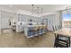 Kitchen island with barstool seating, modern stainless appliances and gray cabinetry at 24540 N 144Th Ave, Surprise, AZ 85387