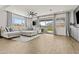 Spacious living room with sliding glass door, neutral colors and a ceiling fan at 24540 N 144Th Ave, Surprise, AZ 85387