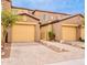Inviting townhome showcasing brick-paved driveway and a private courtyard entry at 250 W Queen Creek Rd # 206, Chandler, AZ 85248