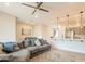Open living space featuring a comfortable sectional sofa, adjacent kitchen and dining area at 250 W Queen Creek Rd # 206, Chandler, AZ 85248