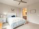 Comfortable bedroom featuring a ceiling fan, neutral paint, and decoratives at 250 W Queen Creek Rd # 206, Chandler, AZ 85248