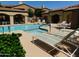 Community pool featuring multiple lounge chairs, shade and a spa at 250 W Queen Creek Rd # 206, Chandler, AZ 85248