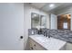 Clean and modern bathroom with tiled backsplash, granite countertop, and bright vanity at 2502 E Malibu Dr, Tempe, AZ 85282