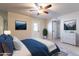 A Primary bedroom features a ceiling fan and an ensuite bathroom at 2502 E Malibu Dr, Tempe, AZ 85282