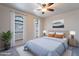 Bright bedroom featuring a comfortable bed and natural light from arched windows at 2502 E Malibu Dr, Tempe, AZ 85282