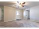 Spacious bedroom with ceiling fan and a door to the backyard at 2502 E Malibu Dr, Tempe, AZ 85282