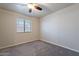 Empty bedroom with neutral carpeting and natural light from a single window at 2502 E Malibu Dr, Tempe, AZ 85282