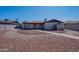 Exterior view of the home with desert landscaping and decorative rock at 2502 E Malibu Dr, Tempe, AZ 85282