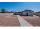 Back exterior view of the house with desert landscaping and decorative rock at 2502 E Malibu Dr, Tempe, AZ 85282