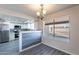 Bright kitchen area with stainless steel appliances, white cabinetry, and an eat in dining space at 2502 E Malibu Dr, Tempe, AZ 85282