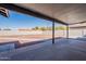 View of the covered patio with a large backyard featuring gravel and concrete; a perfect outdoor space at 2502 E Malibu Dr, Tempe, AZ 85282