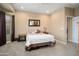 Comfortable bedroom with plush carpet, neutral paint, and a view of the window and exterior at 27030 W Escuda Dr, Buckeye, AZ 85396