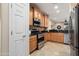 Bright kitchen featuring stainless steel appliances, including a refrigerator, and tile flooring at 27030 W Escuda Dr, Buckeye, AZ 85396