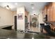 Open kitchen featuring granite countertops, stainless steel appliances, and a view into the dining area at 27030 W Escuda Dr, Buckeye, AZ 85396