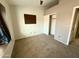 This bedroom has carpet, a closet and a window at 2705 E Rock Wren Rd, Phoenix, AZ 85048