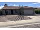 Charming single story home with desert landscaping and a two car garage at 2705 E Rock Wren Rd, Phoenix, AZ 85048
