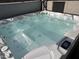 Clear hot tub is ready for a relaxing soak and features several jets and seating at 2705 E Rock Wren Rd, Phoenix, AZ 85048