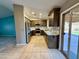 Renovated kitchen with granite countertops, stainless steel appliances, and ample cabinet space at 2705 E Rock Wren Rd, Phoenix, AZ 85048