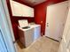 Laundry room with white cabinetry and a washer and dryer at 2705 E Rock Wren Rd, Phoenix, AZ 85048