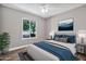 Staged bedroom with hardwood floors, natural light from a window, and stylish furniture at 2741 S Brooks --, Mesa, AZ 85202