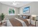 Nicely furnished bedroom with neutral walls, hardwood floors, and bright window for natural light at 2741 S Brooks --, Mesa, AZ 85202